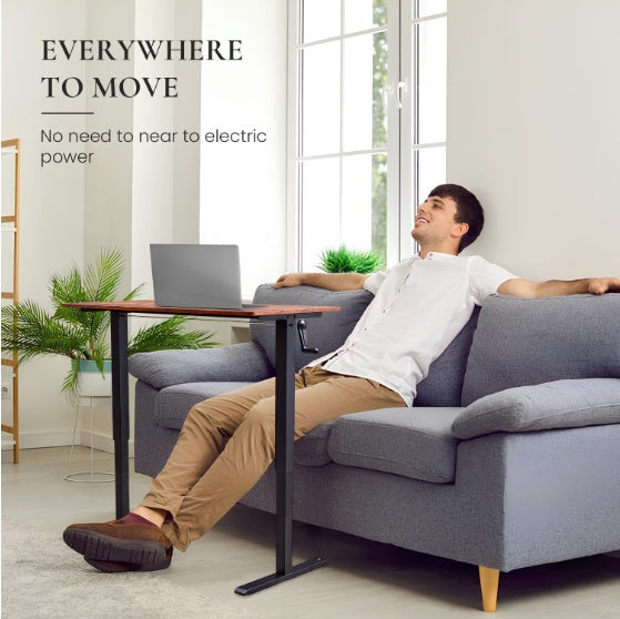 Hand-cranked adjustable desk with flat metal legs in a home setting, ideal for versatile use.