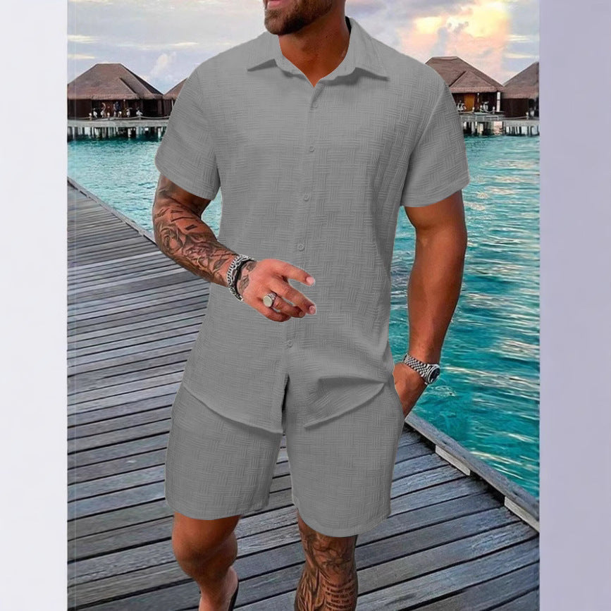 A two-piece set of jacquard black and white solid color short-sleeved men's vacation casual style shirt and shorts