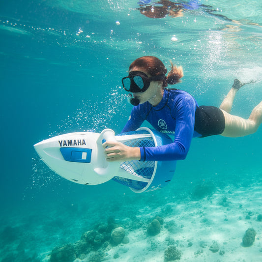 Person underwater holding a Yamaha underwater scooter