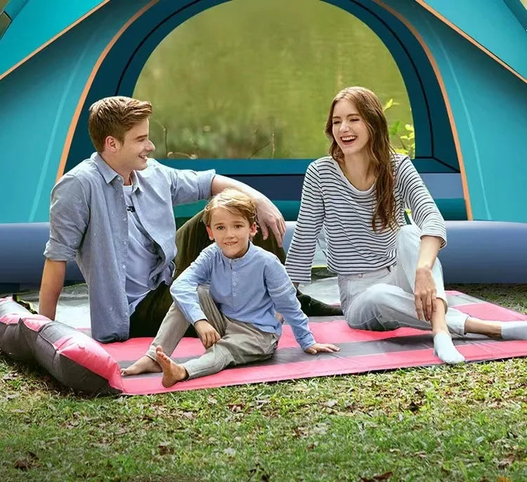 Family enjoying time in front of a 3-4 Double Automatic Camping Tent in a natural setting.