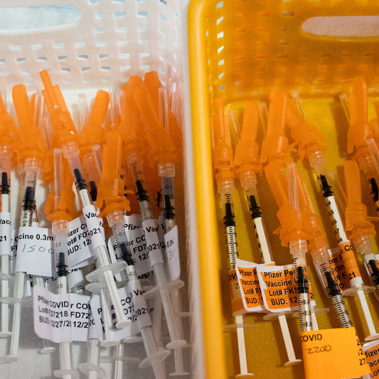 F.D.A. Official Overruled Scientists on Wide Access to Covid Shots