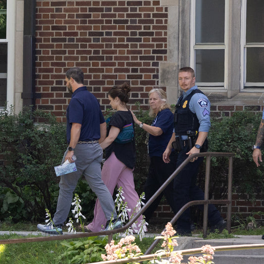 Faculty acted ‘within seconds’ to shield students from bullets, the school said.