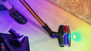 I Tried It: Dyson's Newest Stick Vac Empties So Neatly, I Could Do It in Bed