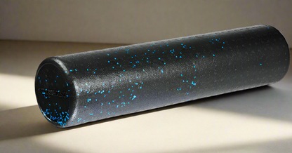 Black foam roller with blue speckles and measurements on a white background